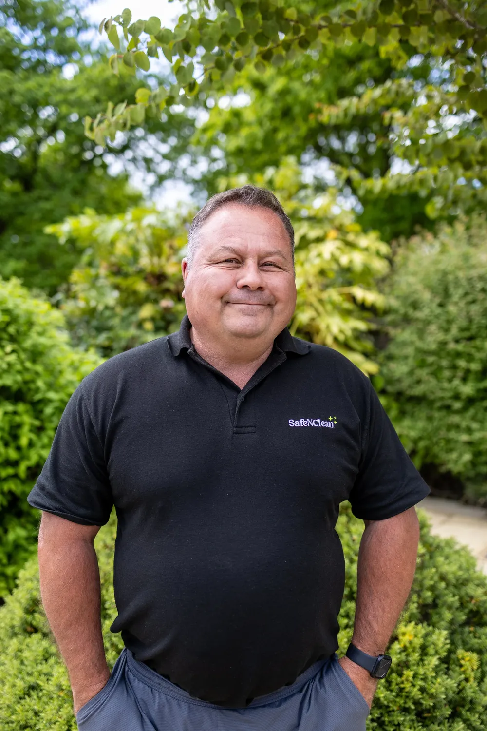 Member of the Safe'N'Clean team in a branded polo shirt